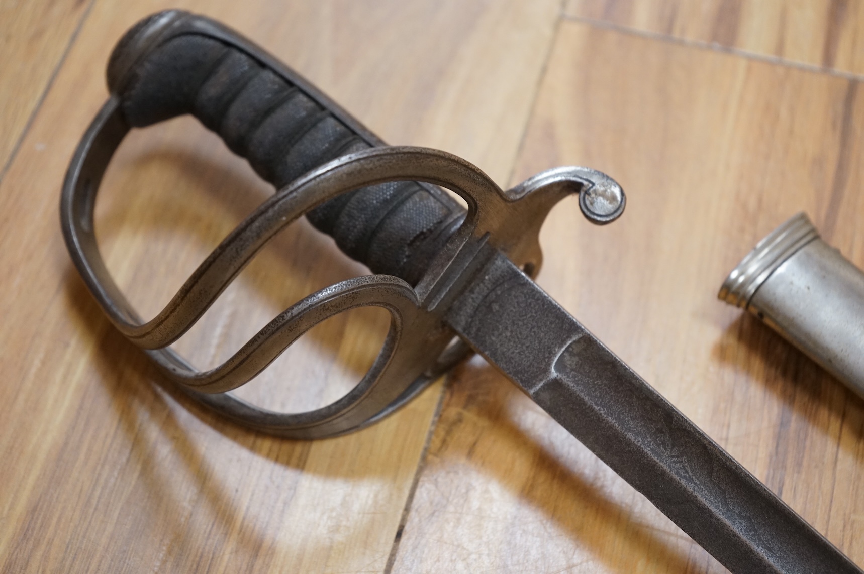 A Victorian 1845 pattern infantry officer’s levee sword, with slender blade etched; Hamburger Rogers & Co., and crowned VR and foliage, regulation pierced brass guard with folding side guard, wire bound fish skin covered